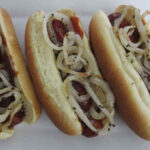 Hot Dogs with Spicy Sauce and Grilled Onions