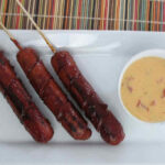 Spiral Hot Dogs with Queso Sauce